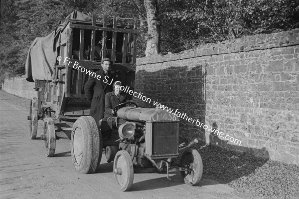 WOMAN DRIVING TRACTOR BRINGING HOME THE HAY